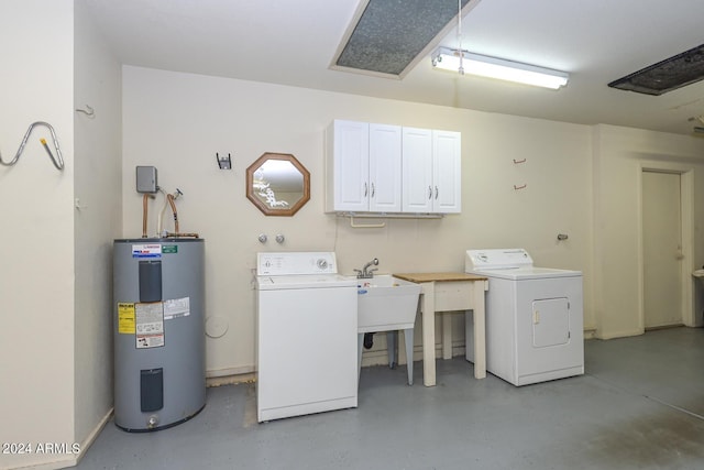 laundry room featuring separate washer and dryer, cabinets, and electric water heater