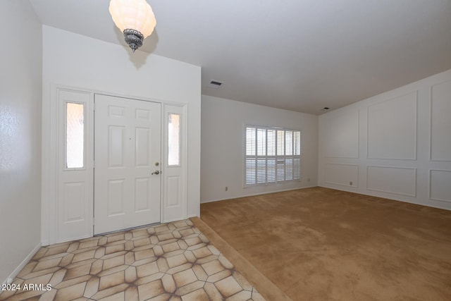 entryway with light carpet