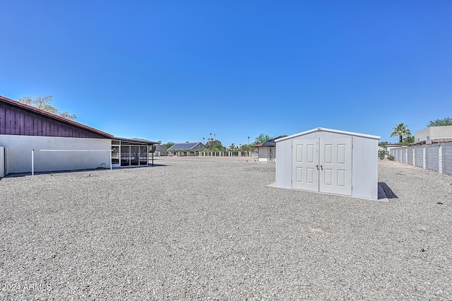 view of yard with a storage unit