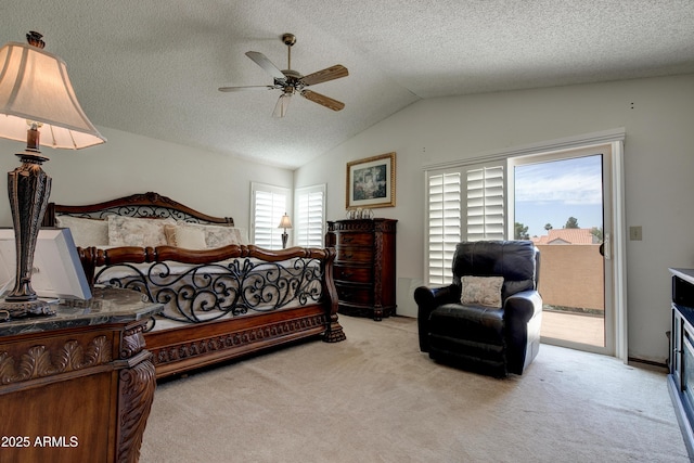 bedroom with access to outside, a textured ceiling, lofted ceiling, and carpet