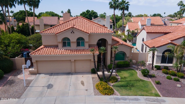 mediterranean / spanish-style house featuring a residential view, stucco siding, driveway, and a tile roof