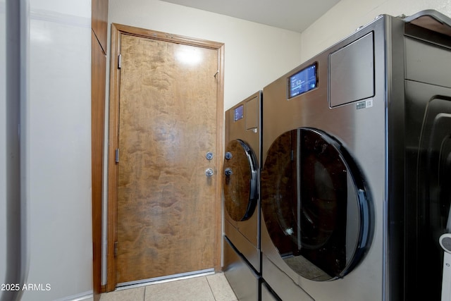 laundry area with laundry area and tile patterned flooring