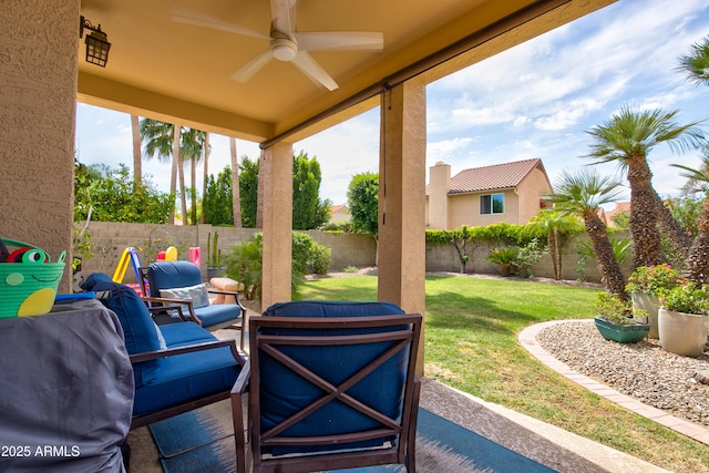 view of patio featuring a ceiling fan, outdoor lounge area, and a fenced backyard