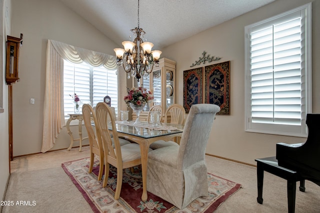 dining space featuring carpet floors, baseboards, a textured ceiling, a notable chandelier, and vaulted ceiling