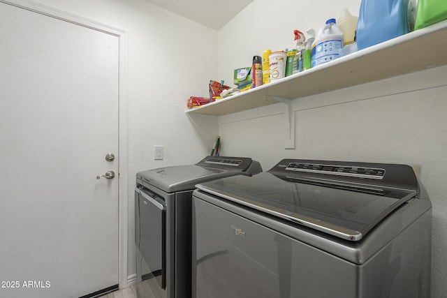 washroom with laundry area and washer and dryer