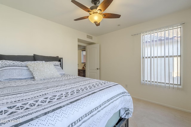 bedroom featuring light carpet, ceiling fan, visible vents, and baseboards