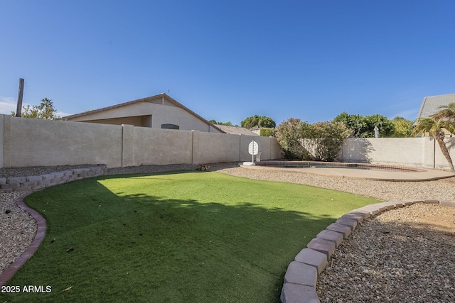 view of yard with a fenced backyard