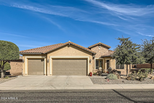 mediterranean / spanish-style home featuring a garage