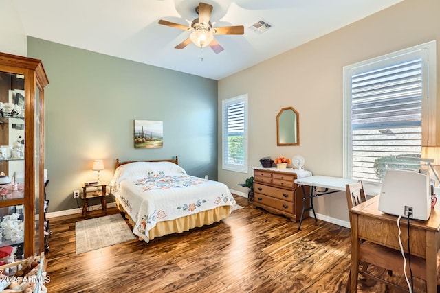 bedroom with ceiling fan and dark hardwood / wood-style floors