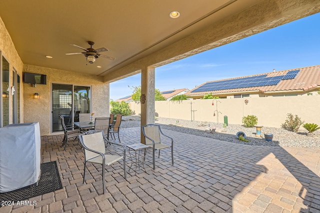 view of patio with ceiling fan