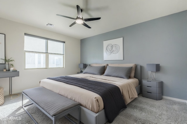 bedroom with light carpet, baseboards, visible vents, and ceiling fan