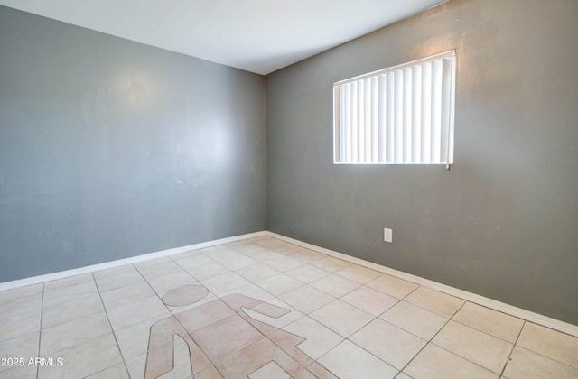 unfurnished room with light tile patterned floors