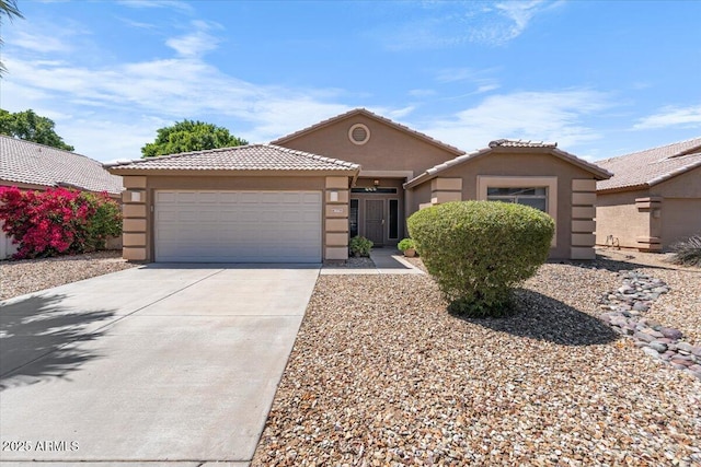 7778 N 51st Ln, Glendale, AZ 85301 - ranch-style house featuring concrete driveway, stucco siding, an attached garage, and a tile roof