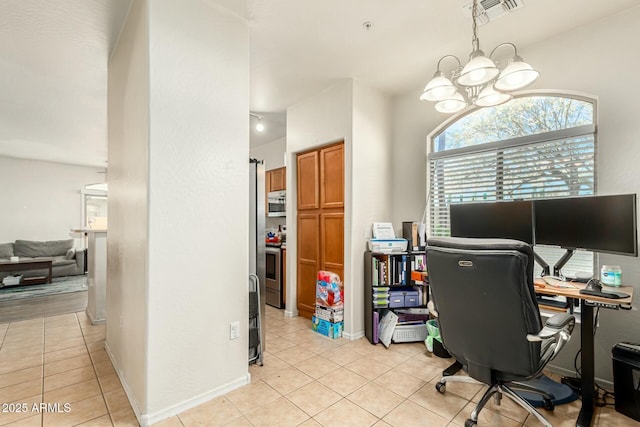 tiled home office featuring an inviting chandelier