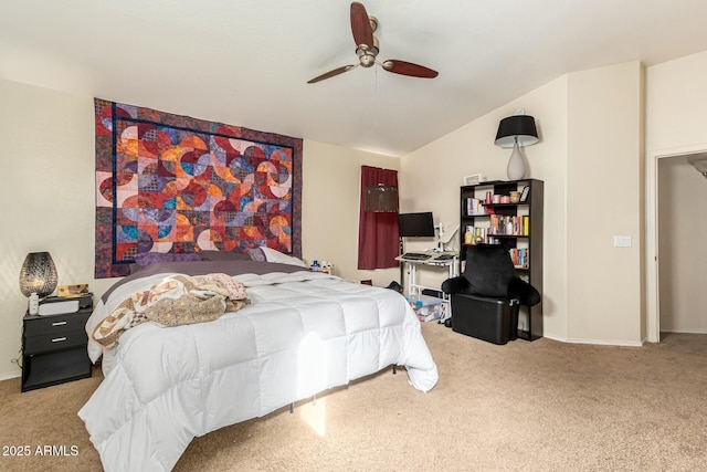 bedroom with ceiling fan, vaulted ceiling, and carpet