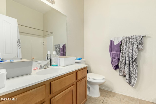 bathroom featuring walk in shower, vanity, toilet, and tile patterned flooring