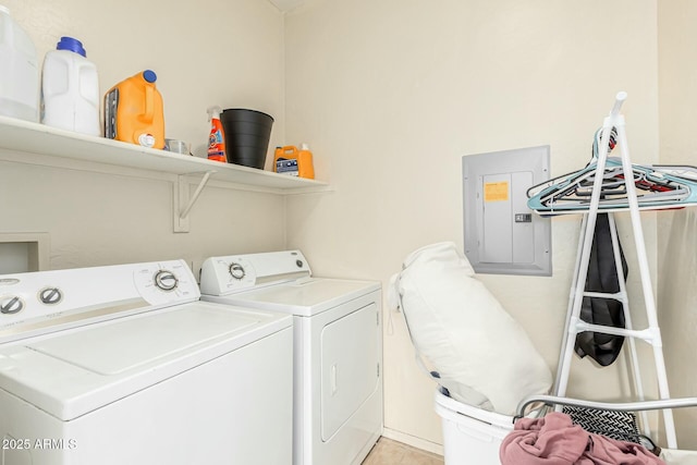 clothes washing area featuring electric panel and washing machine and clothes dryer