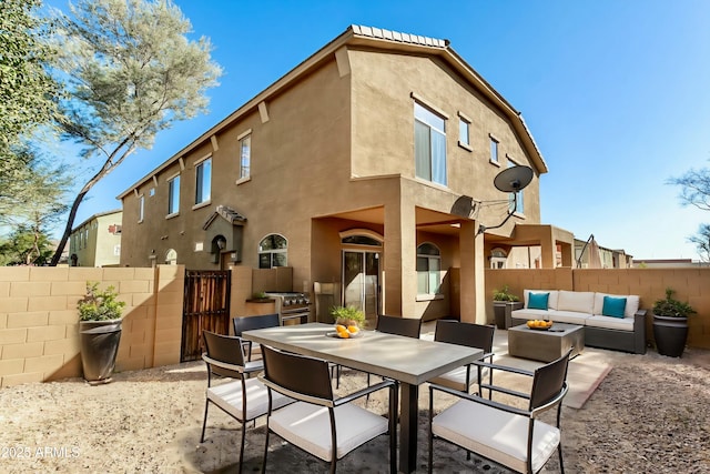 back of house with an outdoor hangout area and a patio area