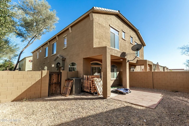 back of house with a patio and central air condition unit