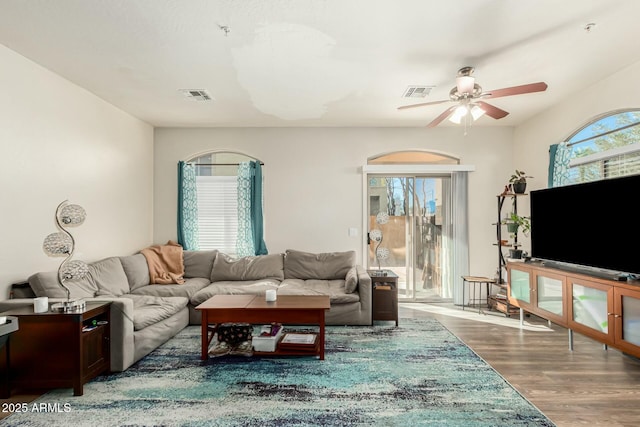 living room with hardwood / wood-style floors and ceiling fan