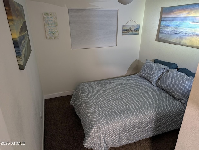 bedroom with dark colored carpet