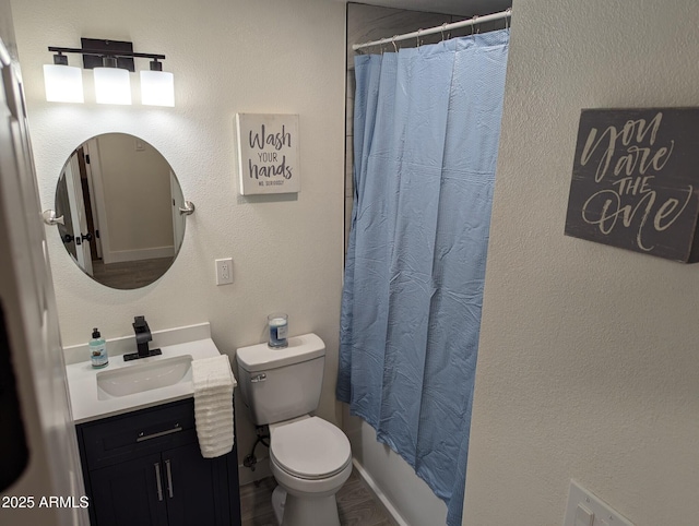 full bathroom featuring toilet, vanity, and shower / tub combo with curtain