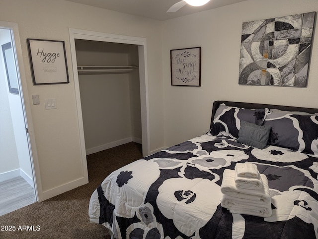 bedroom featuring a closet, dark colored carpet, and ceiling fan