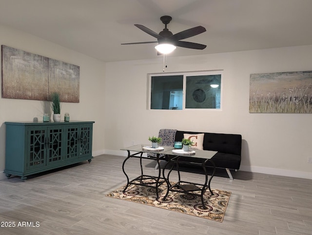 interior space with ceiling fan and light hardwood / wood-style floors