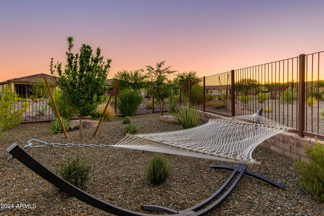 patio terrace at dusk featuring an outdoor living space and a pergola