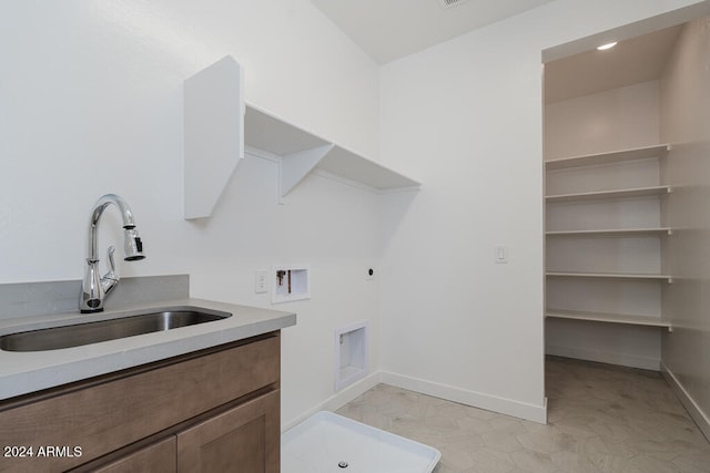 laundry area featuring hookup for an electric dryer, sink, washer hookup, and cabinets