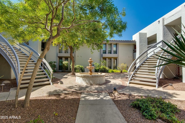 view of property's community with stairs