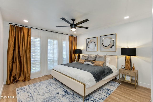 bedroom with recessed lighting, baseboards, light wood finished floors, and ceiling fan