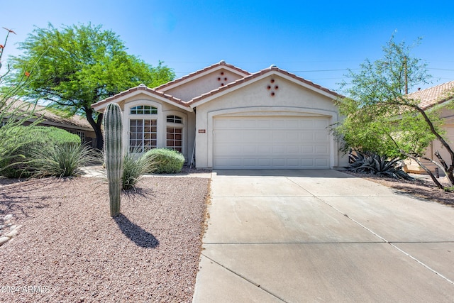 view of front of property with a garage