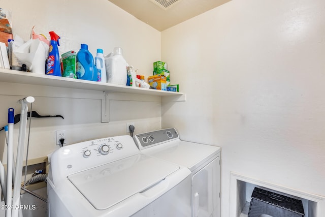 laundry area featuring electric dryer hookup and washer and clothes dryer