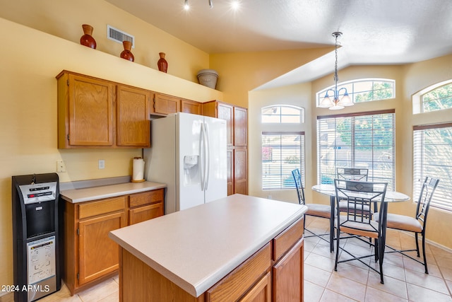 kitchen with a kitchen island, light tile flooring, white fridge with ice dispenser, lofted ceiling, and pendant lighting