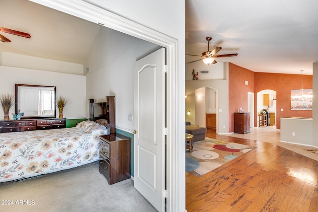 bedroom featuring ceiling fan, carpet floors, and lofted ceiling