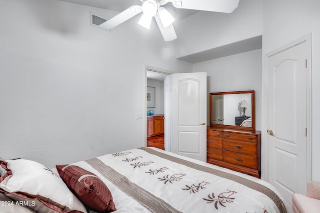 bedroom with ceiling fan and hardwood / wood-style flooring