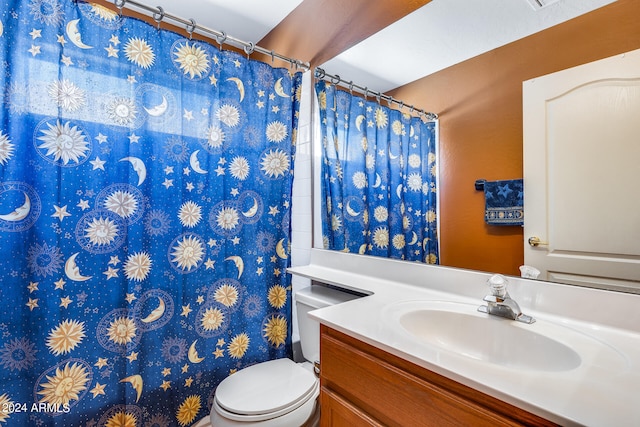 bathroom with oversized vanity and toilet