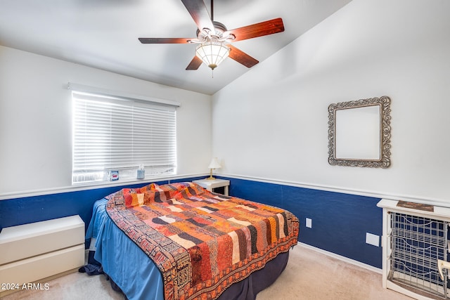 carpeted bedroom featuring lofted ceiling and ceiling fan