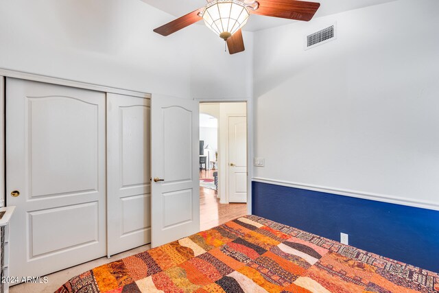 unfurnished bedroom with a closet and ceiling fan