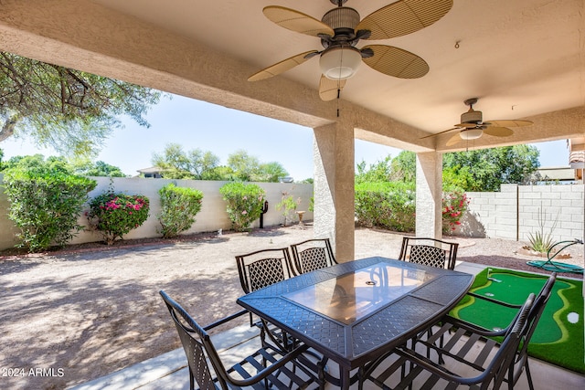 view of terrace featuring ceiling fan