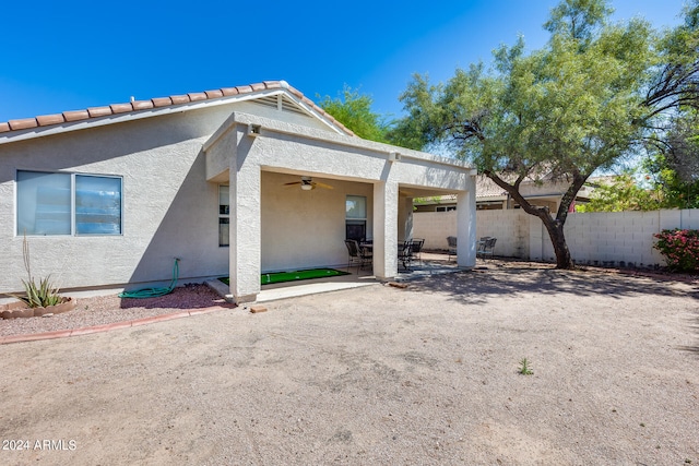 back of house featuring ceiling fan and a patio