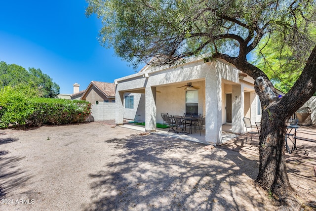 back of house featuring ceiling fan and a patio area