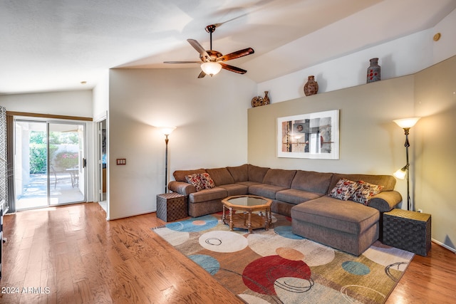 living room featuring wood-type flooring, ceiling fan, and lofted ceiling