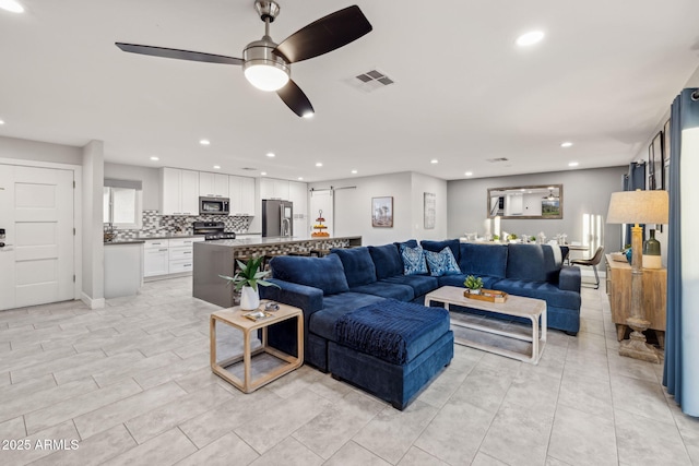 living room featuring ceiling fan