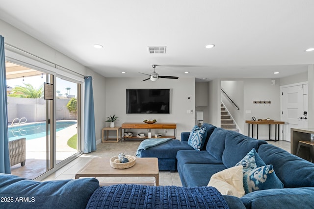 tiled living room featuring ceiling fan