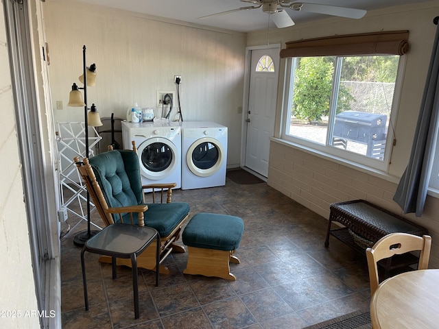 clothes washing area featuring ceiling fan and washer and clothes dryer