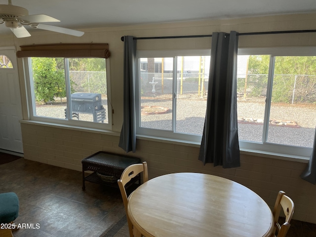 dining space featuring ceiling fan