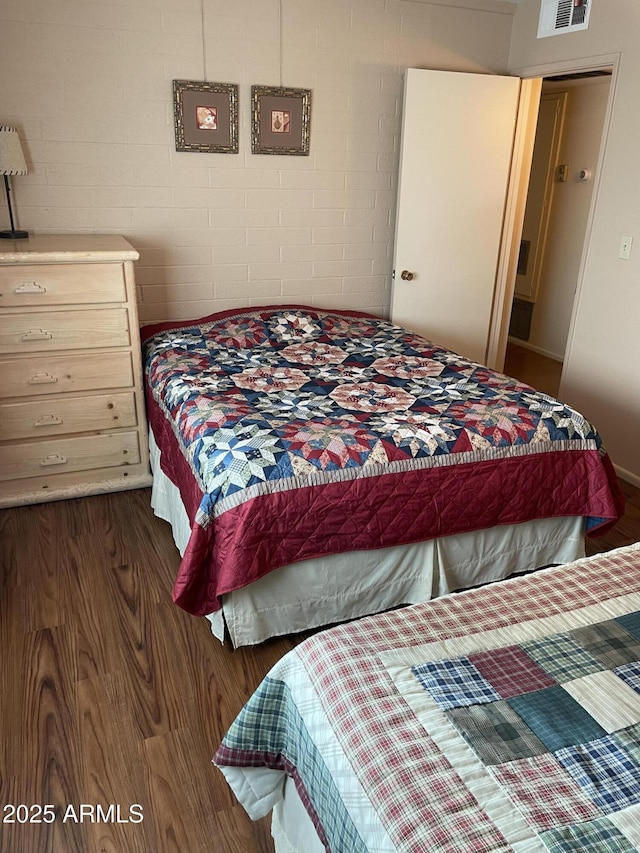 bedroom featuring dark hardwood / wood-style floors