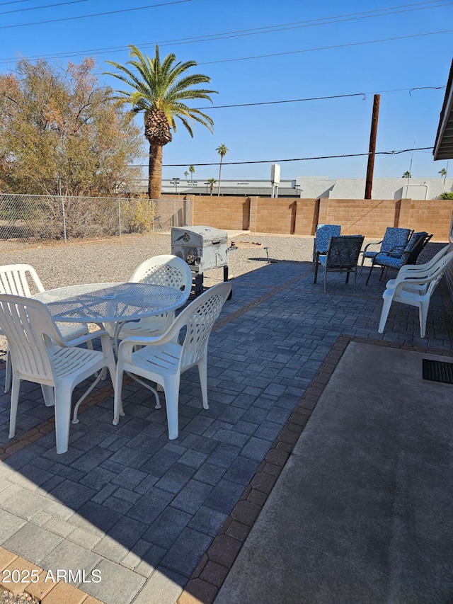 view of patio with a grill